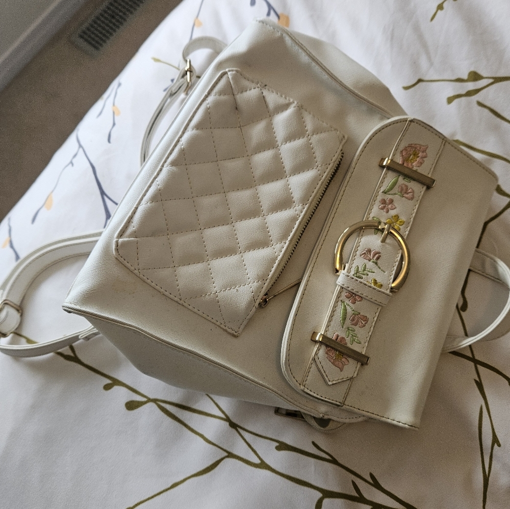 Cream backpack with floral design